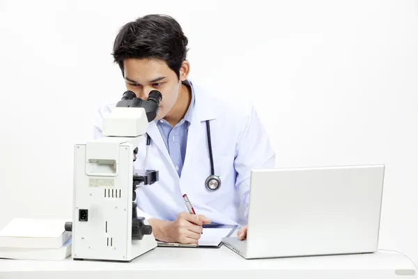 Closeup of doctor at his desk in front of computer — Stock Photo, Image