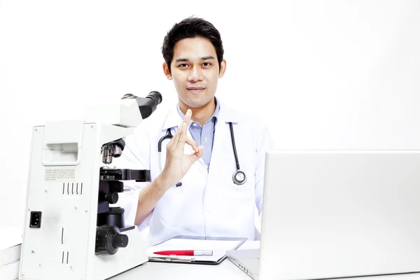 Closeup of doctor at his desk in front of computer — Stock Photo, Image