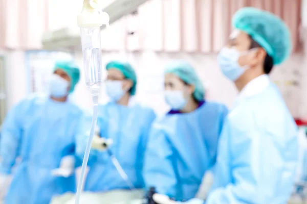 Doctor in operation room with his team — Stock Photo, Image