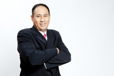 Beyaz arka plan üzerinde ayakta olgun iş adamı