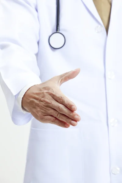 Medical concept with a doctor ready to handshake — Stock Photo, Image