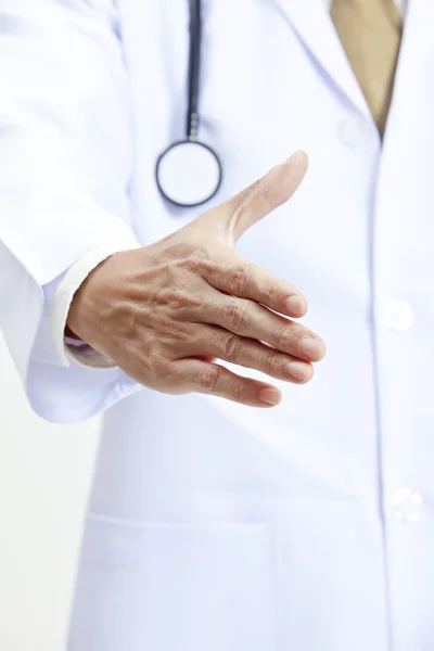 Medical concept with a doctor ready to handshake — Stock Photo, Image