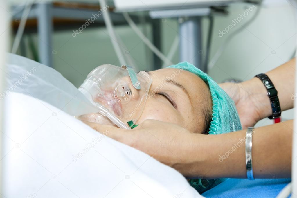 Portrait of woman patient receiving artificial ventilation in hospital