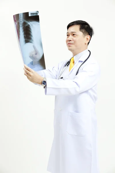 Senior doctor checking xray results — Stock Photo, Image