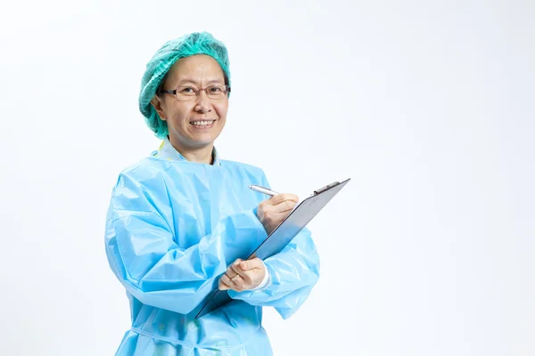 Smiling mature female medical doctor with stethoscope and clipboard — Stock Photo, Image