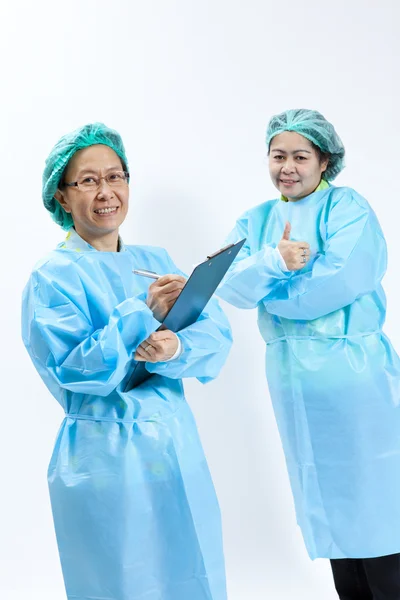 Smiling female medical doctor and nurse with stethoscope and clipboard — Stock Photo, Image