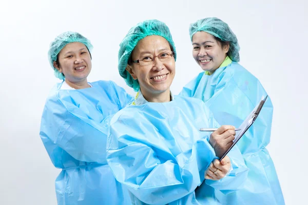 Group of smiling female medical doctor and nurse with stethoscope and clipboard — Stock Photo, Image