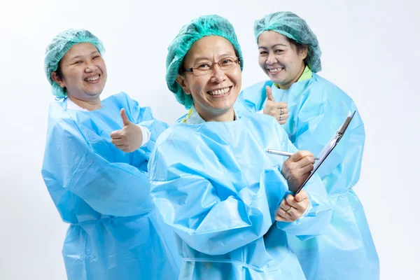 Group of smiling female medical doctor and nurse with stethoscope and clipboard — Stock Photo, Image