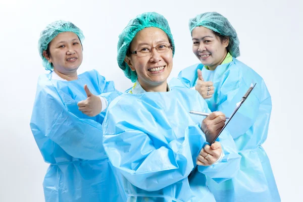 Group of smiling female medical doctor and nurse with stethoscope and clipboard — Stock Photo, Image