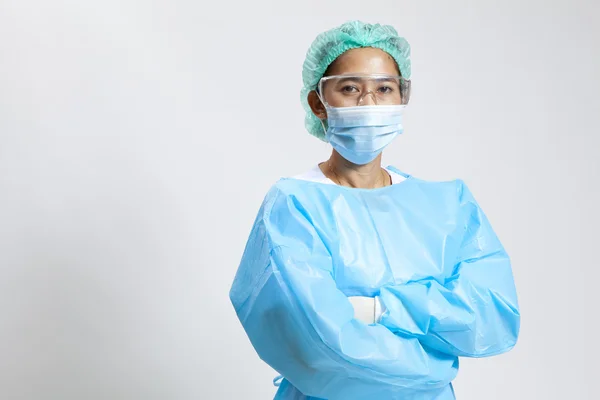 Smiling young female medical doctor with stethoscope and mask — Stock Photo, Image