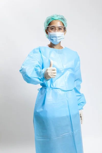 Smiling young female medical doctor with stethoscope and mask — Stock Photo, Image