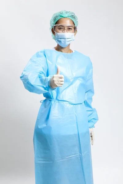 Smiling young female medical doctor with stethoscope and mask — Stock Photo, Image