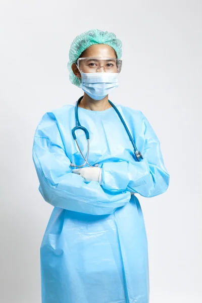 Smiling young female medical doctor with stethoscope and mask — Stock Photo, Image