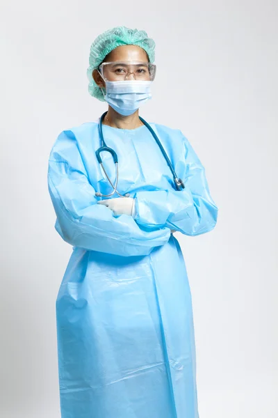 Smiling young female medical doctor with stethoscope and mask — Stock Photo, Image