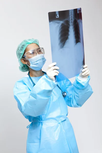 Young and nice doctor watching a patient x-ray in hospital — Stock Photo, Image