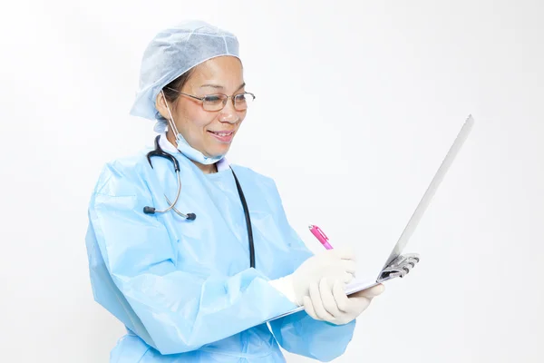 Female doctor writing on medical chart - copyspace — Stock Photo, Image