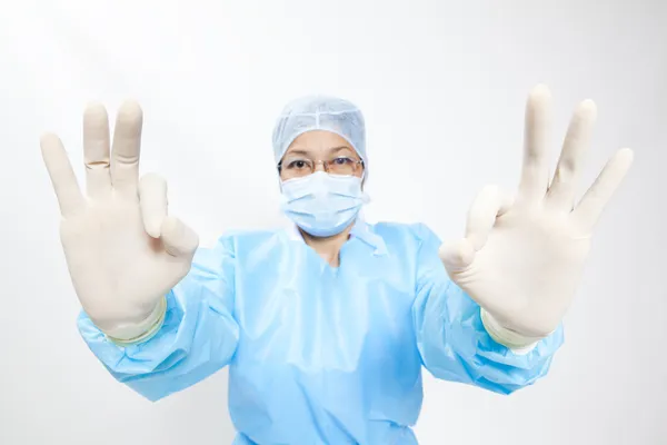 Asian doctor give you an ok gesture, closeup portrait on white background. — Stock Photo, Image