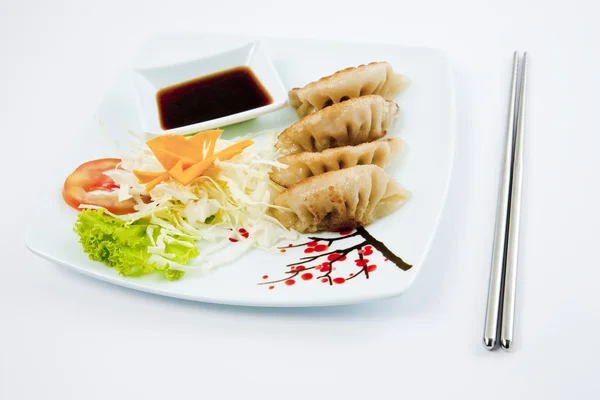 Fried Pork and Shrimp Dumplings on a dish with Soy Sauce and chopsticks — Stock Photo, Image