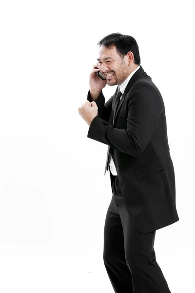 Mature business man talking on the phone over white background — Stock Photo, Image