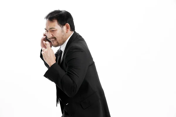 Superstitious - Asian business man with crossed fingers over white background — Stock Photo, Image