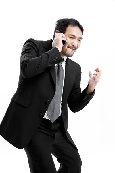 Superstitious - Asian business man with crossed fingers over white background — Stock Photo, Image