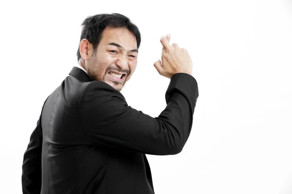 Superstitious - Asian business man with crossed fingers over white background — Stock Photo, Image