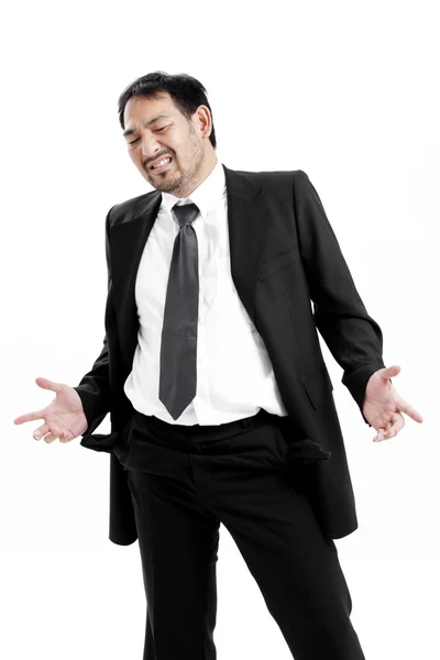 Businessman standing isolated on the white background and showing his empty pocket, turning his pocket inside out, no money — Stock Photo, Image