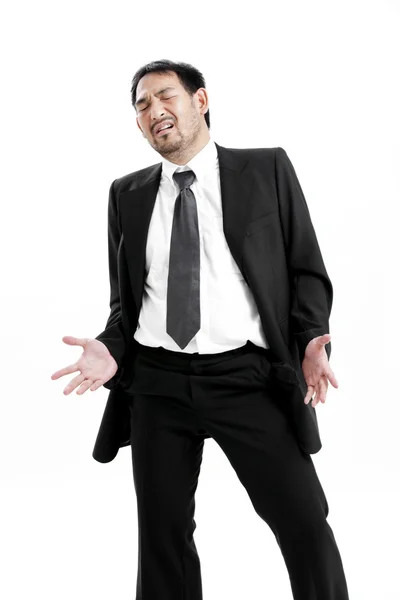 Businessman standing isolated on the white background and showing his empty pocket, turning his pocket inside out, no money — Stock Photo, Image