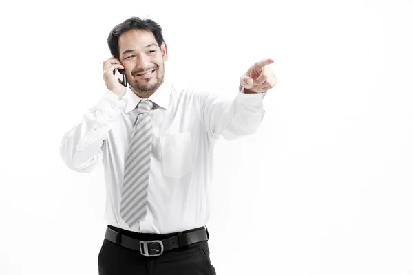 Portrait of a happy young businessman talking on mobile phone — Stock Photo, Image