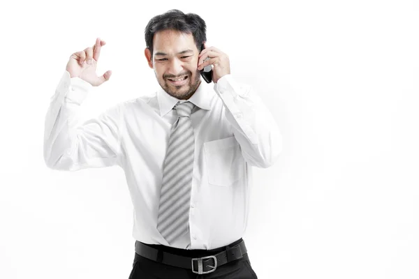 Superstitious - Asian business man with crossed fingers over white background — Stock Photo, Image