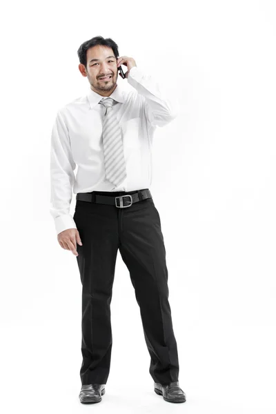 Portrait of a happy young businessman talking on mobile phone — Stock Photo, Image