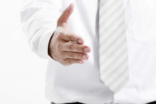 Businessman giving an hand for handshake to seal the deal — Stock Photo, Image