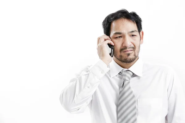 Geschäftsmann telefoniert mit seinem Handy — Stockfoto