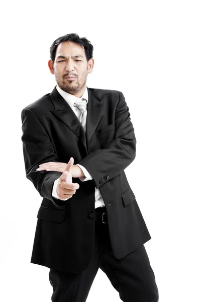 Businessman making a gun gesture. Isolated on white — Stock Photo, Image