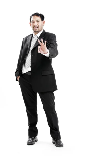 Porträt der Hand mit Ok-Zeichen vor weißem Hintergrund — Stockfoto
