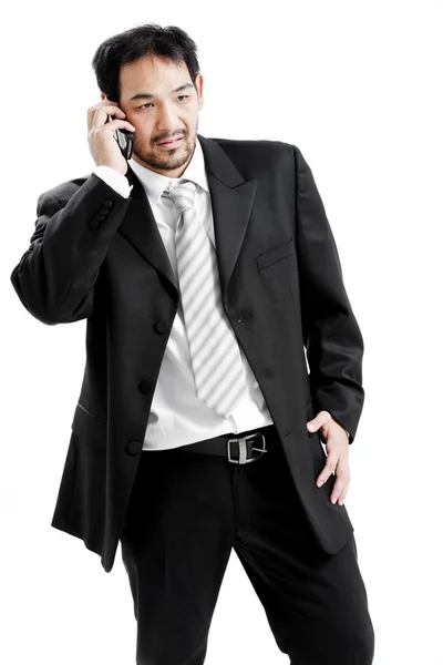 Portrait of a happy young businessman talking on mobile phone — Stock Photo, Image