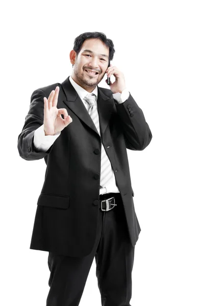 Businessman inside, giving ok sign — Stock Photo, Image