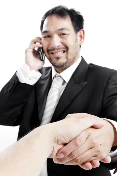 Podnikatel v obleku dává ruku pro handshake zaplombovat řešit — Stock fotografie