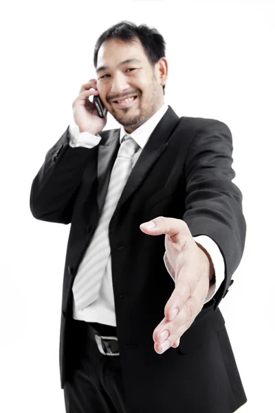 Businessman in suit giving an hand for handshake to seal the deal — Stock Photo, Image