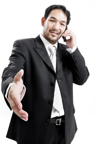 Businessman in suit giving an hand for handshake to seal the deal — Stock Photo, Image