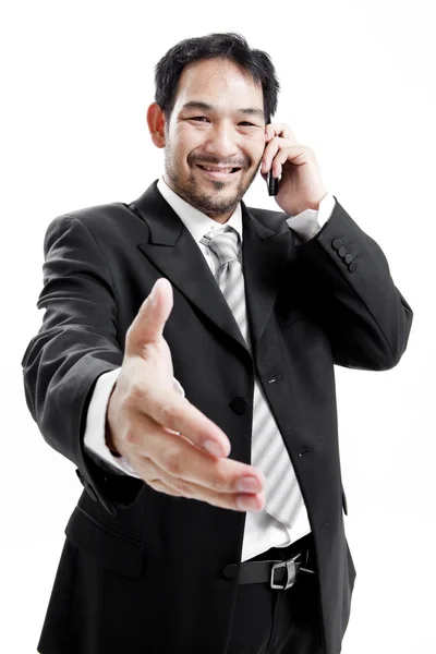 Businessman in suit giving an hand for handshake to seal the deal — Stock Photo, Image