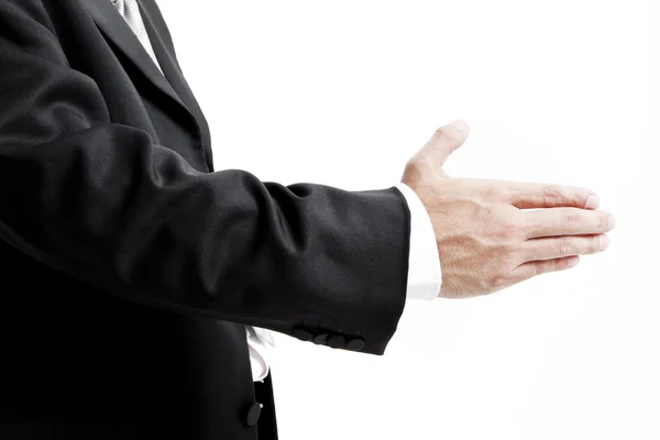 Businessman in suit giving an hand for handshake to seal the deal — Stock Photo, Image