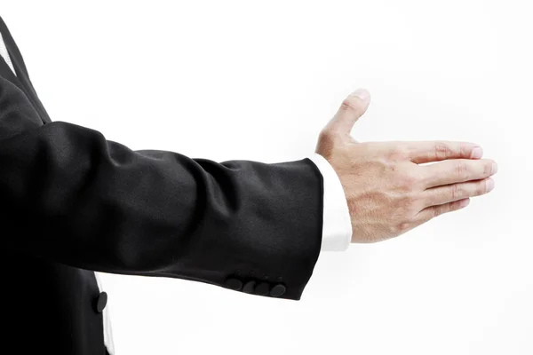 Businessman in suit giving an hand for handshake to seal the deal — Stock Photo, Image