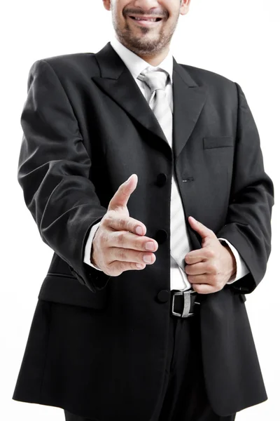 Empresario en traje dando una mano para apretón de manos para sellar el trato — Foto de Stock