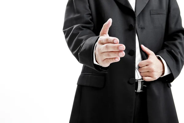 Бизнесмен в костюме протягивает руку для рукопожатия, чтобы заключить сделку — стоковое фото
