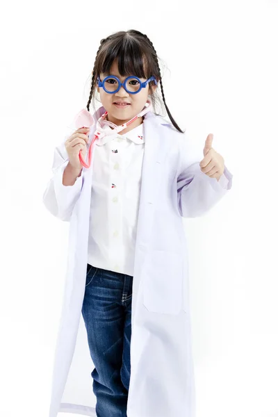 A young asian girl having fun playing dress up as a doctor — Stock Photo, Image