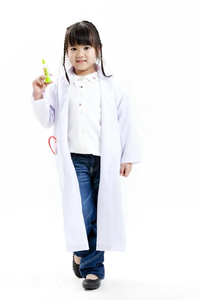 A young asian girl having fun playing dress up as a doctor — Stock Photo, Image