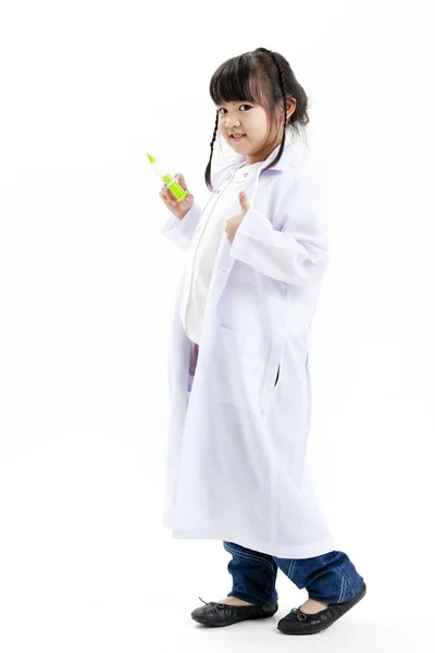 A young asian girl having fun playing dress up as a doctor — Stock Photo, Image