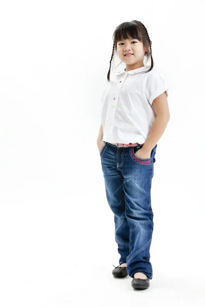 Little girl portrait with white shirt and blue jeans on the white background Stock Picture