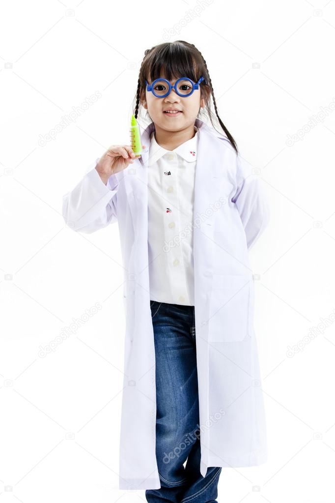 A young asian girl having fun playing dress up as a doctor